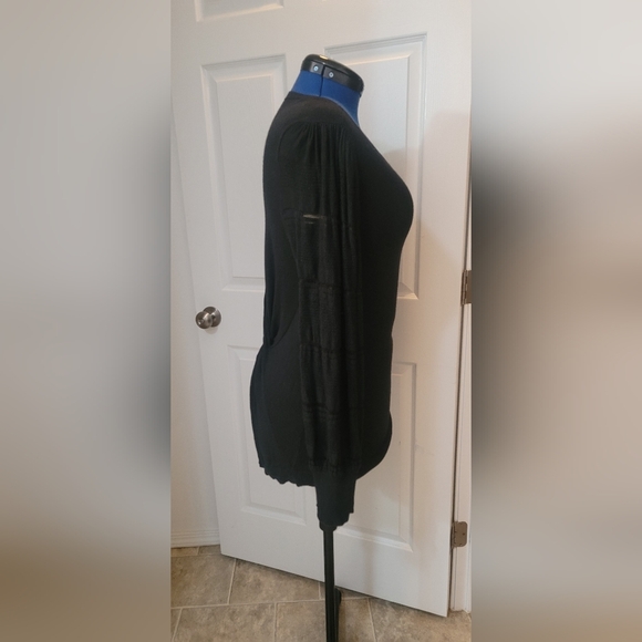 Black sweater with twisted back and lace sleeve detail. - Picture 3 of 7